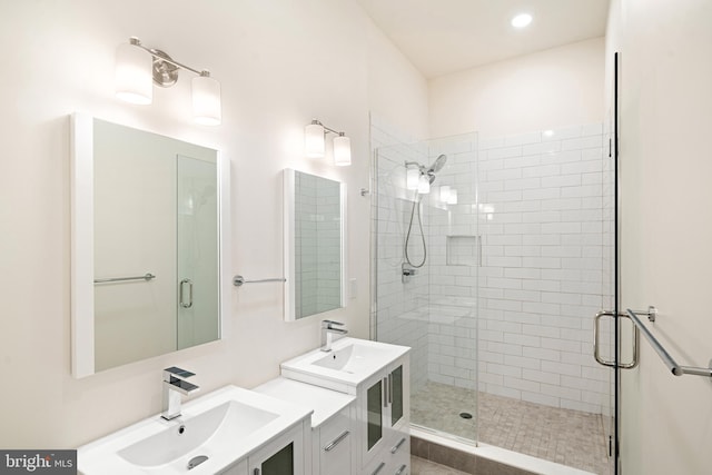 bathroom with vanity and a shower with shower door