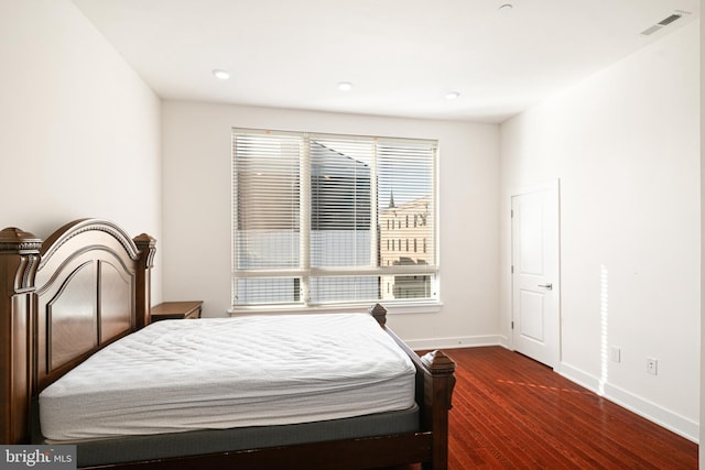 bedroom featuring dark hardwood / wood-style flooring