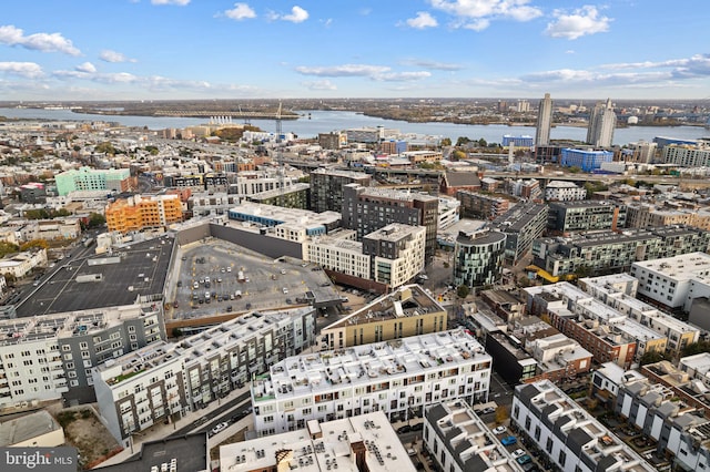 birds eye view of property featuring a view of city and a water view