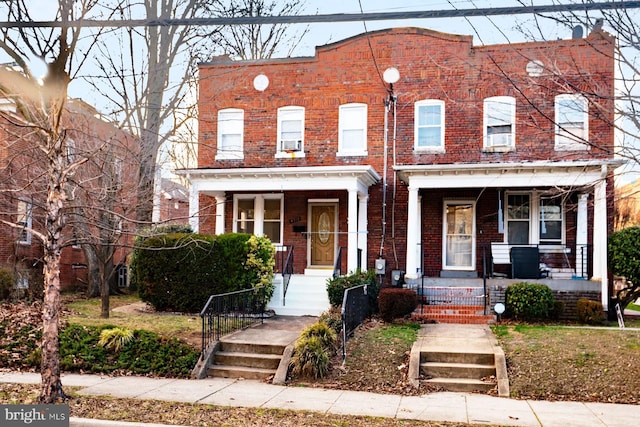 townhome / multi-family property with covered porch