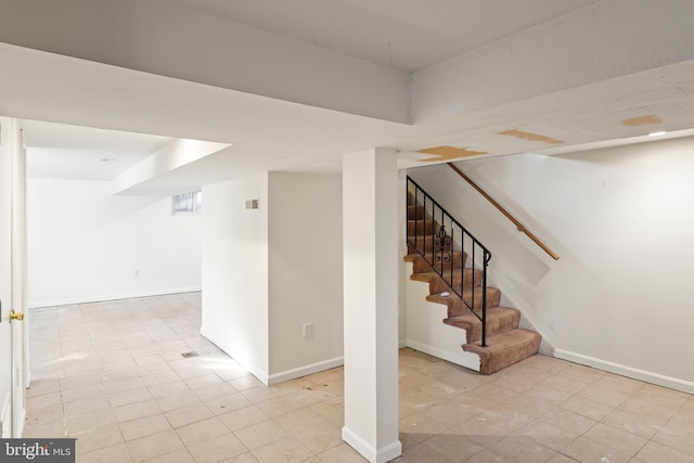 basement with light tile patterned floors