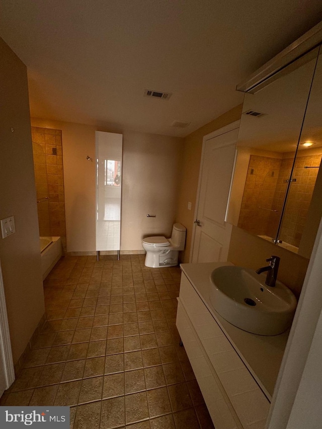 bathroom featuring toilet, visible vents,  shower combination, and vanity