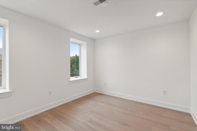 spare room featuring light wood-type flooring