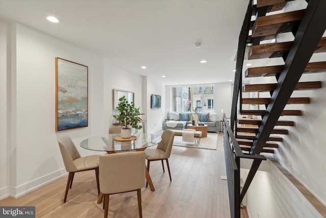 dining space with light wood-type flooring