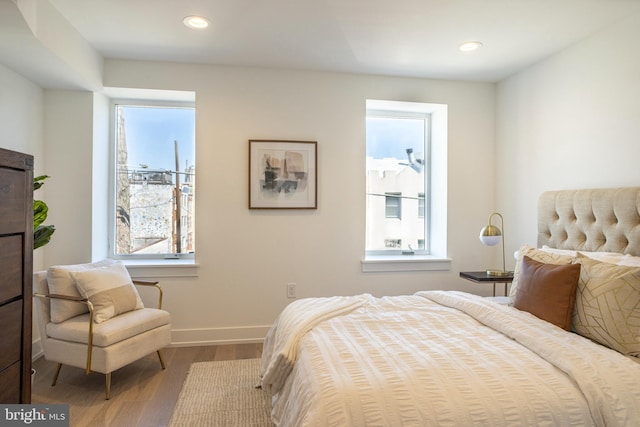 bedroom with hardwood / wood-style flooring