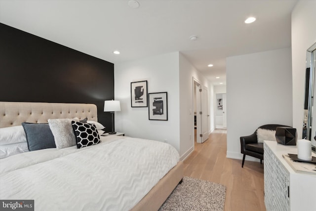 bedroom with light hardwood / wood-style flooring