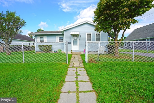 bungalow-style home featuring a front yard