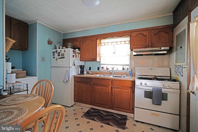 kitchen featuring brown cabinets, light countertops, a sink, white appliances, and under cabinet range hood