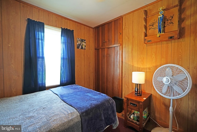 bedroom with wooden walls