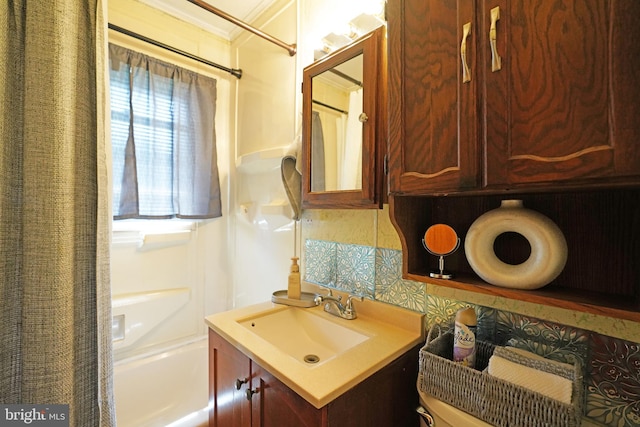 full bathroom with backsplash, shower / bath combination with curtain, toilet, and vanity