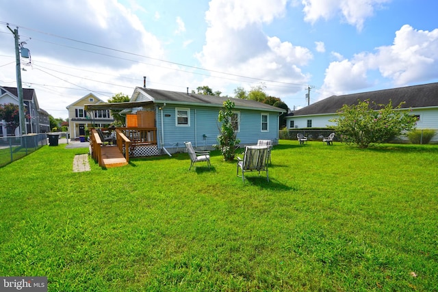 view of yard featuring a wooden deck