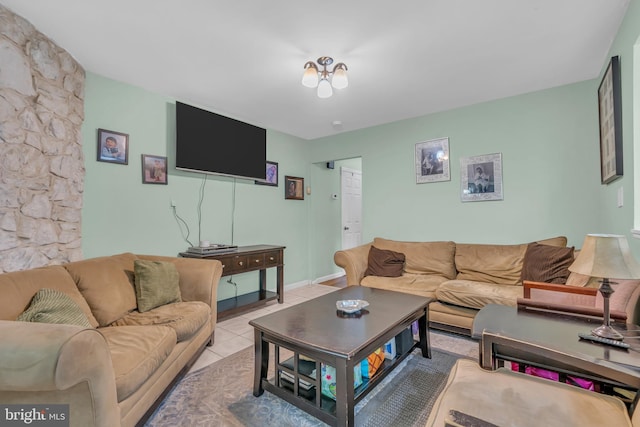 living room with light tile patterned floors and baseboards