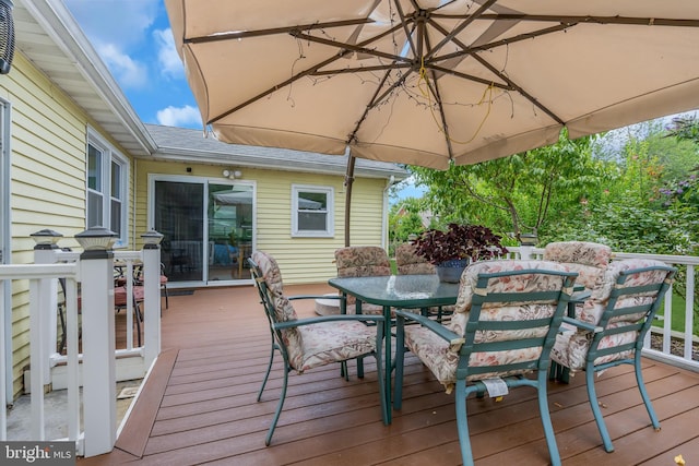 wooden deck with outdoor dining space