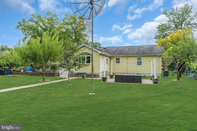 rear view of property featuring a patio area, central AC unit, a lawn, and an outdoor hangout area