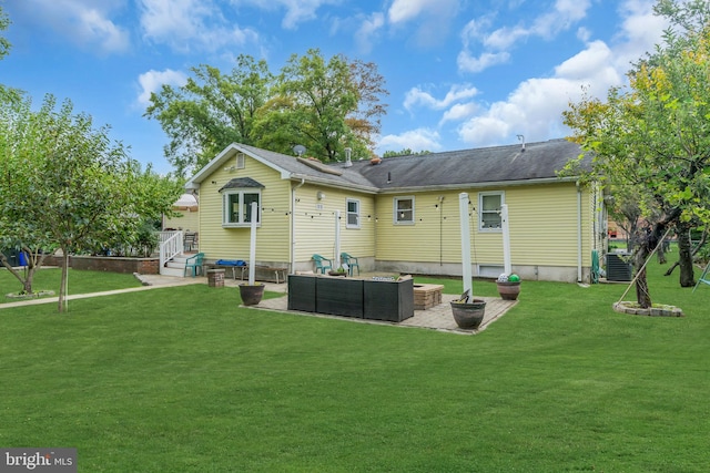 rear view of house with a patio, a lawn, and outdoor lounge area