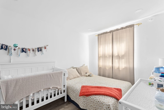 bedroom with hardwood / wood-style flooring