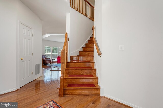 stairway featuring hardwood / wood-style flooring