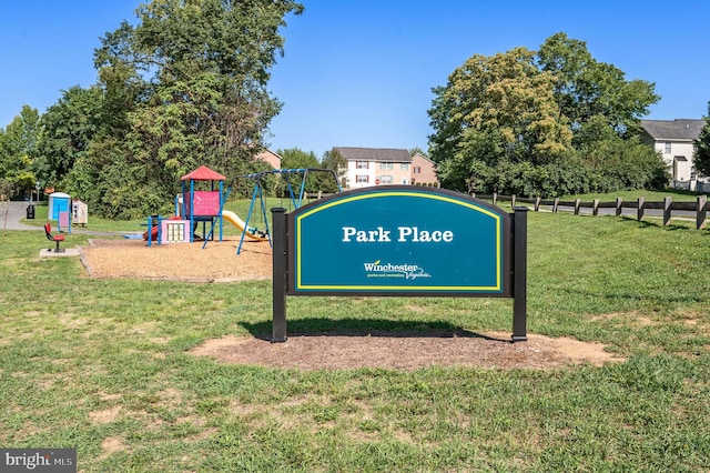 view of community with a playground and a yard