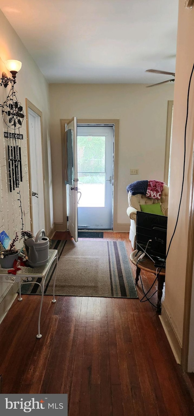 doorway to outside with ceiling fan and hardwood / wood-style flooring