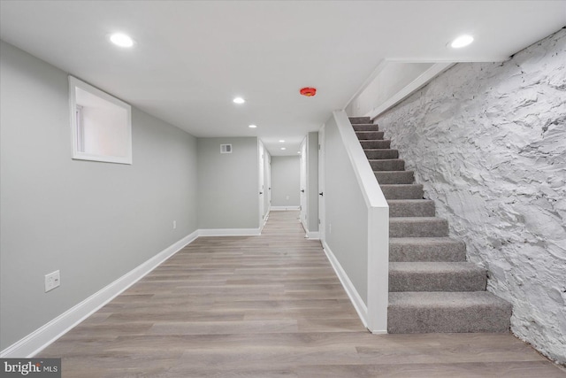 basement featuring hardwood / wood-style floors