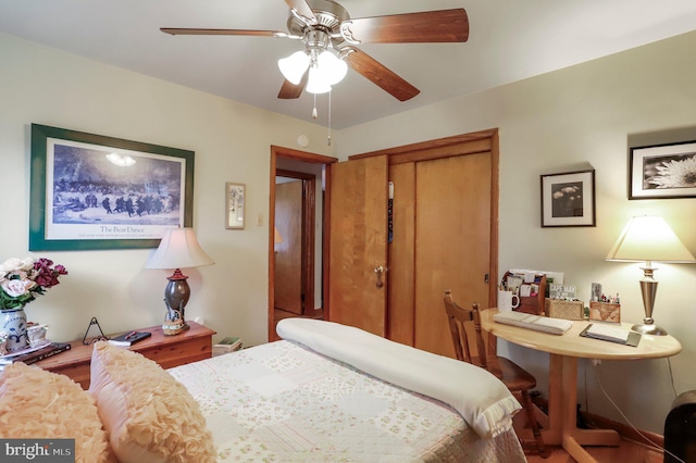 bedroom with ceiling fan and a closet