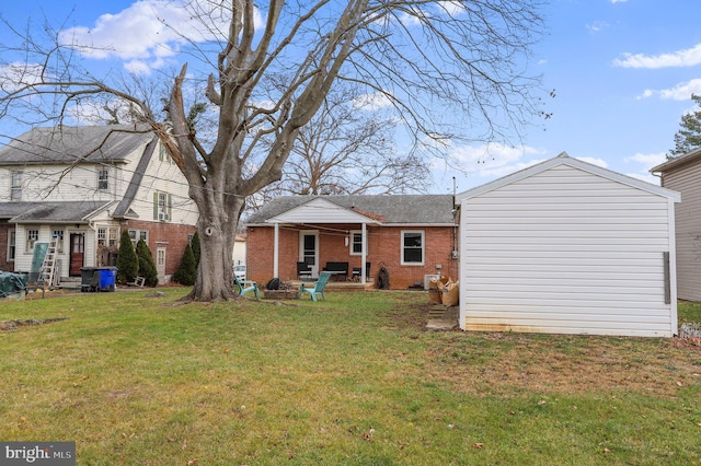 back of property featuring a lawn