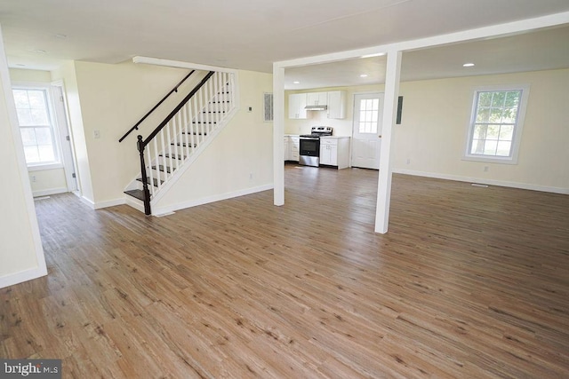 unfurnished living room with light hardwood / wood-style floors