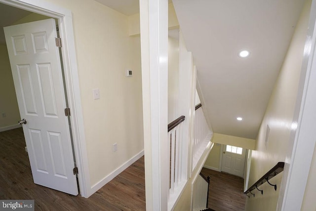 stairway with hardwood / wood-style floors