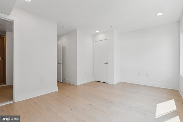 unfurnished room featuring light wood-type flooring