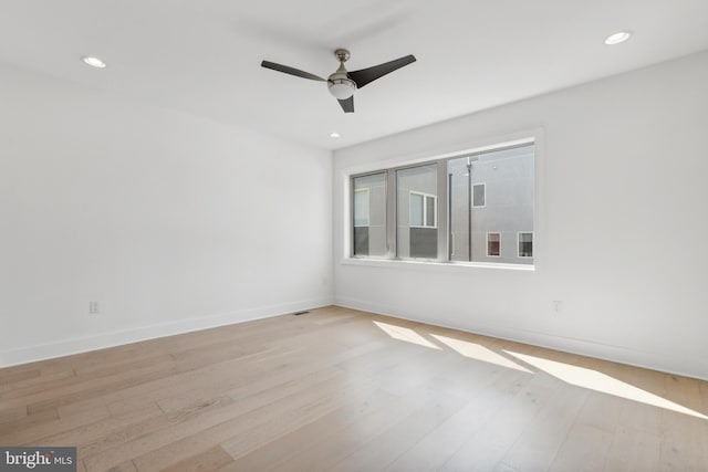 unfurnished room with light hardwood / wood-style flooring and ceiling fan