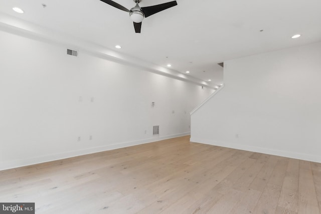 spare room with ceiling fan and light hardwood / wood-style floors