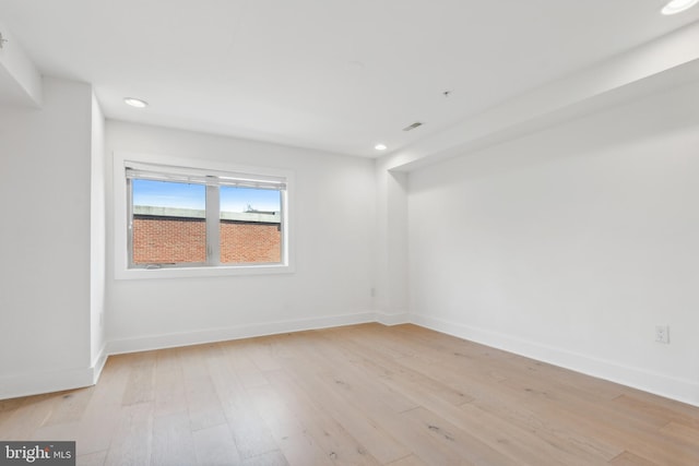 spare room with light wood-type flooring