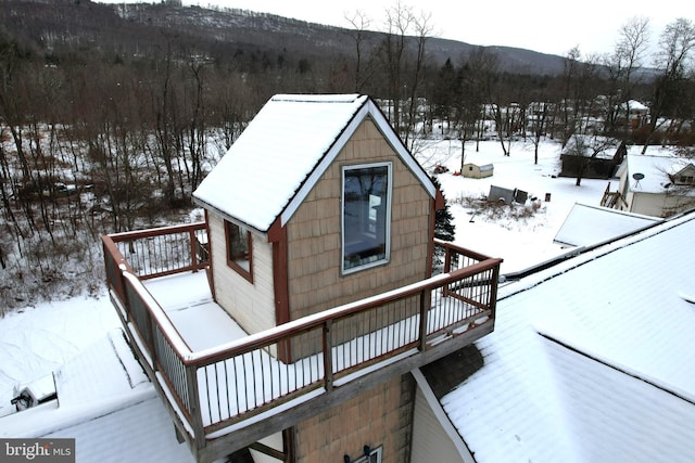 exterior space featuring a deck with mountain view