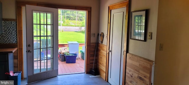 doorway to outside with wood-type flooring