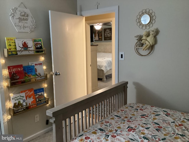 bedroom featuring light colored carpet