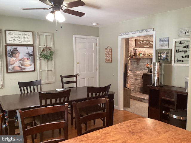 dining room featuring ceiling fan and hardwood / wood-style flooring