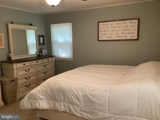 carpeted bedroom with ornamental molding