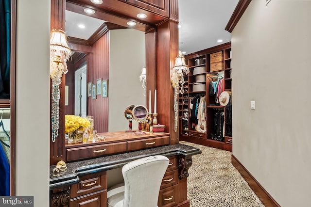 office with built in desk and crown molding