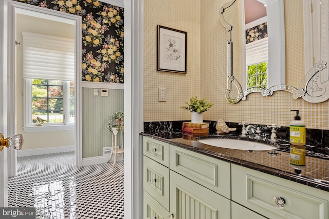 bathroom with tile patterned floors, plenty of natural light, and vanity