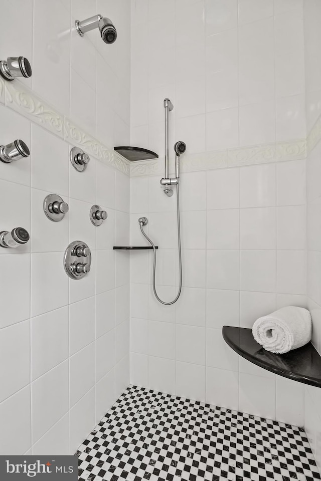 bathroom with a tile shower