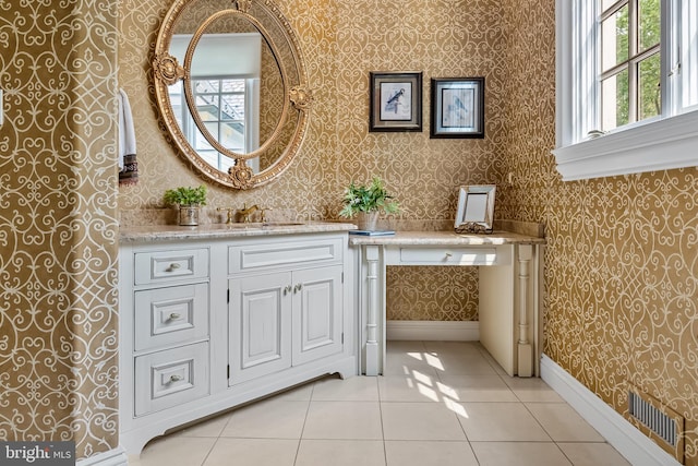 bathroom featuring tile patterned flooring and vanity