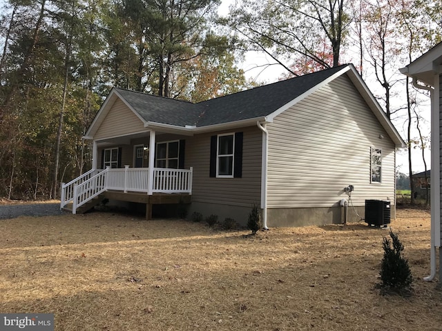 view of front of house featuring a porch and central AC unit