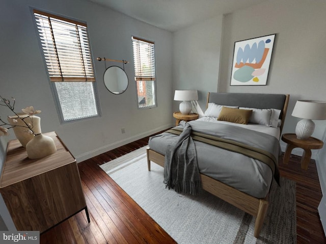 bedroom with hardwood / wood-style flooring and baseboards