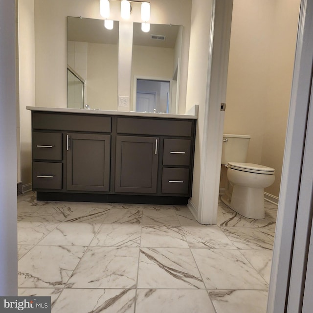 bathroom with vanity and toilet