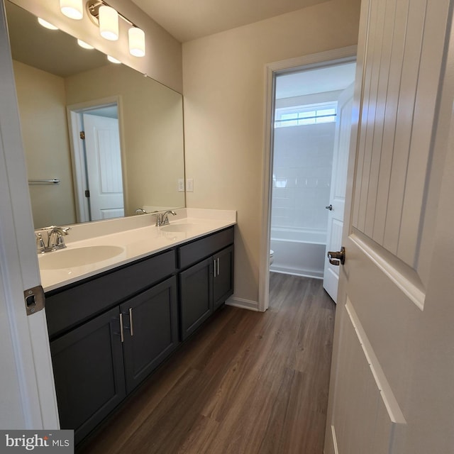 bathroom with hardwood / wood-style floors and vanity