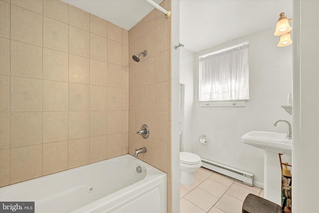 bathroom with a baseboard heating unit, tiled shower / bath, toilet, and tile patterned flooring