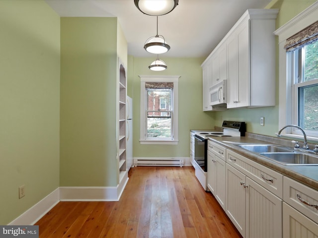 kitchen with white cabinetry, sink, white appliances, and a baseboard heating unit