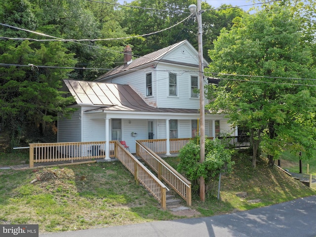 view of front of property featuring covered porch