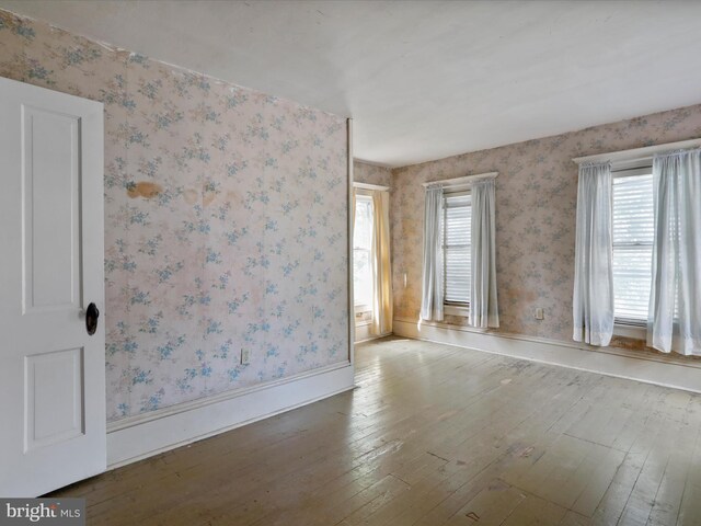 unfurnished room featuring hardwood / wood-style floors