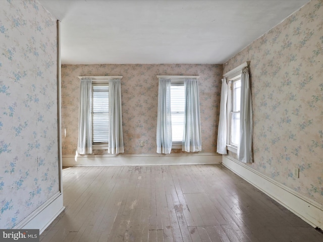 spare room with hardwood / wood-style flooring